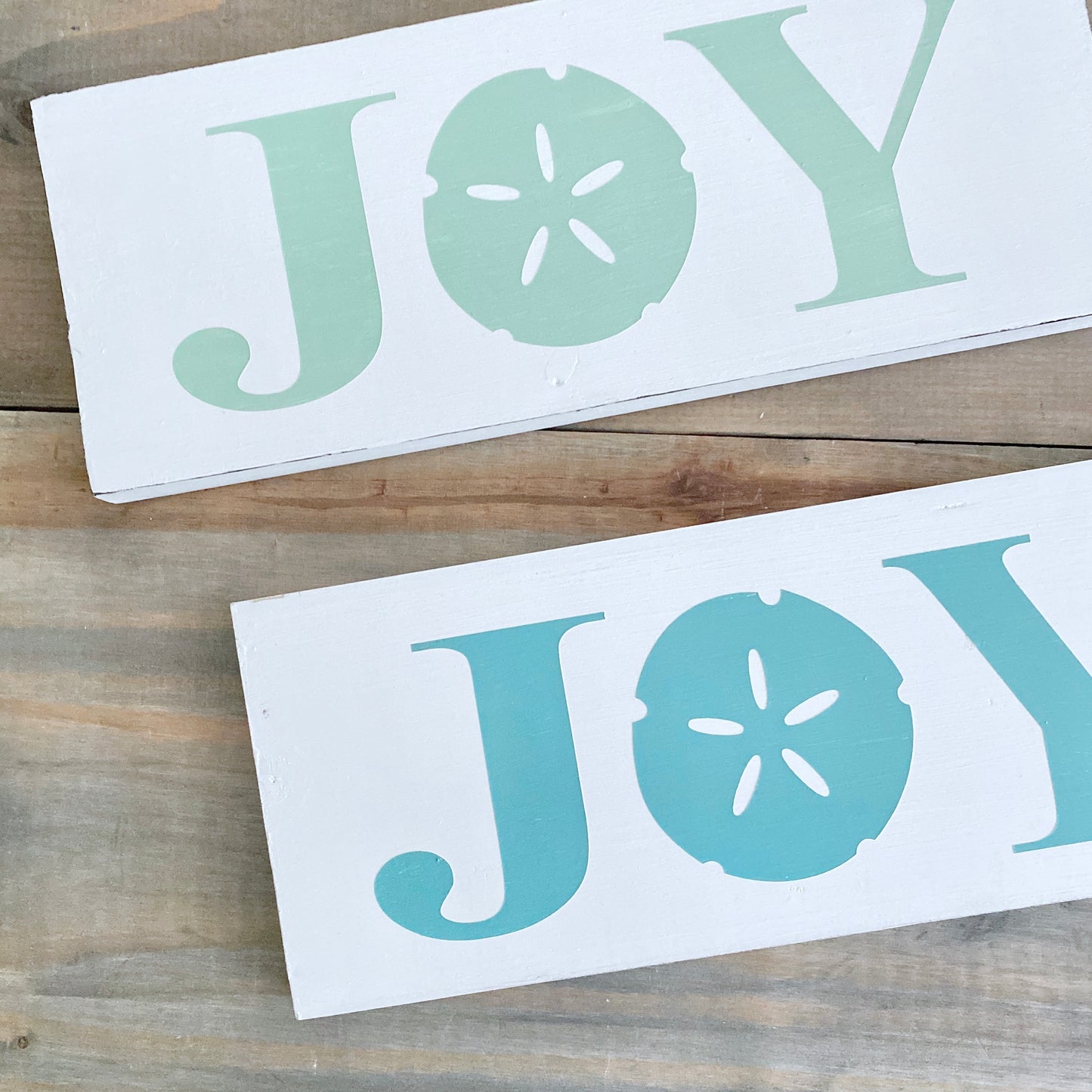 Joy Sand Dollar Sign