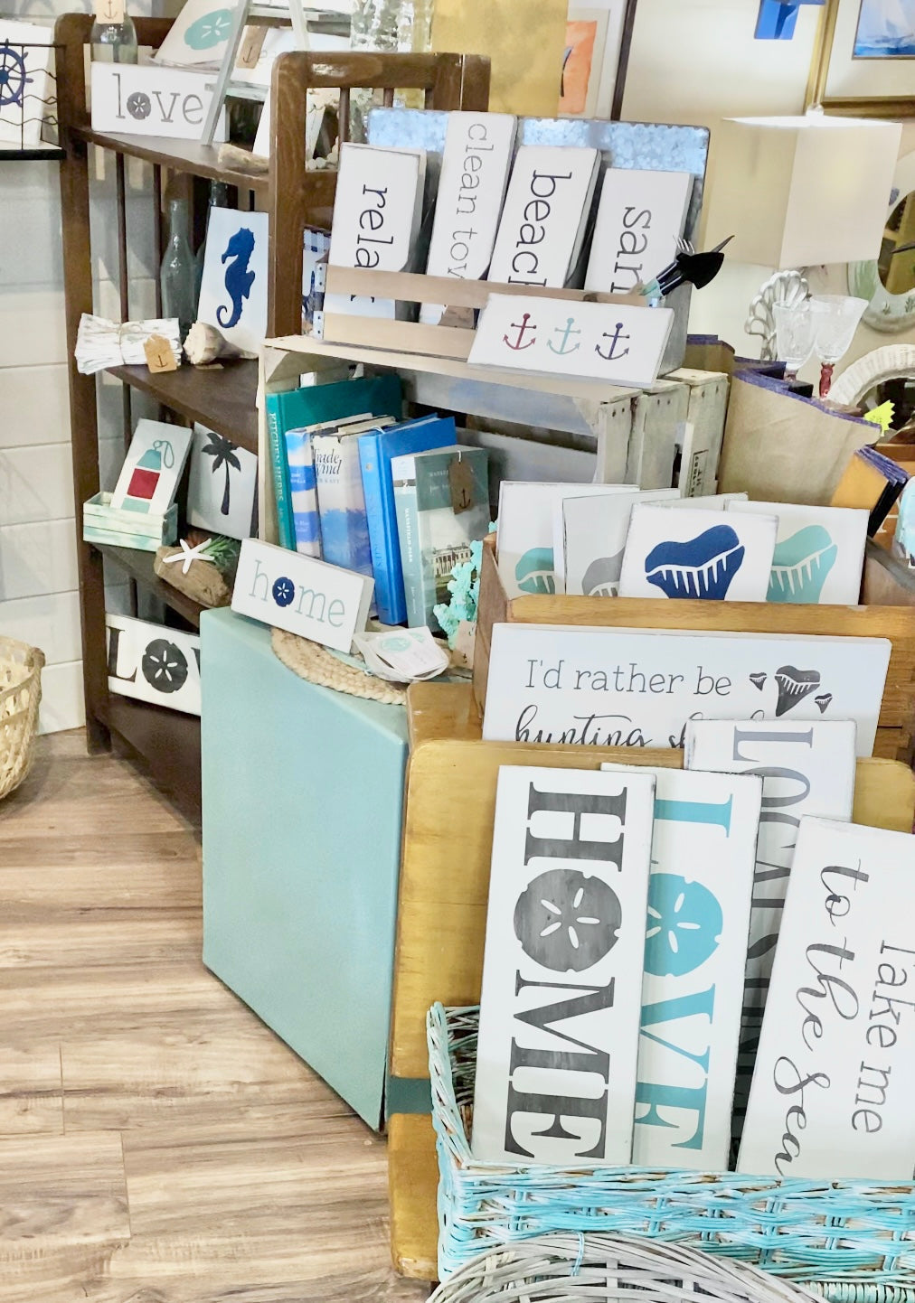 Eye-catching retail display with handmade wood beach signs in a coastal gift shop