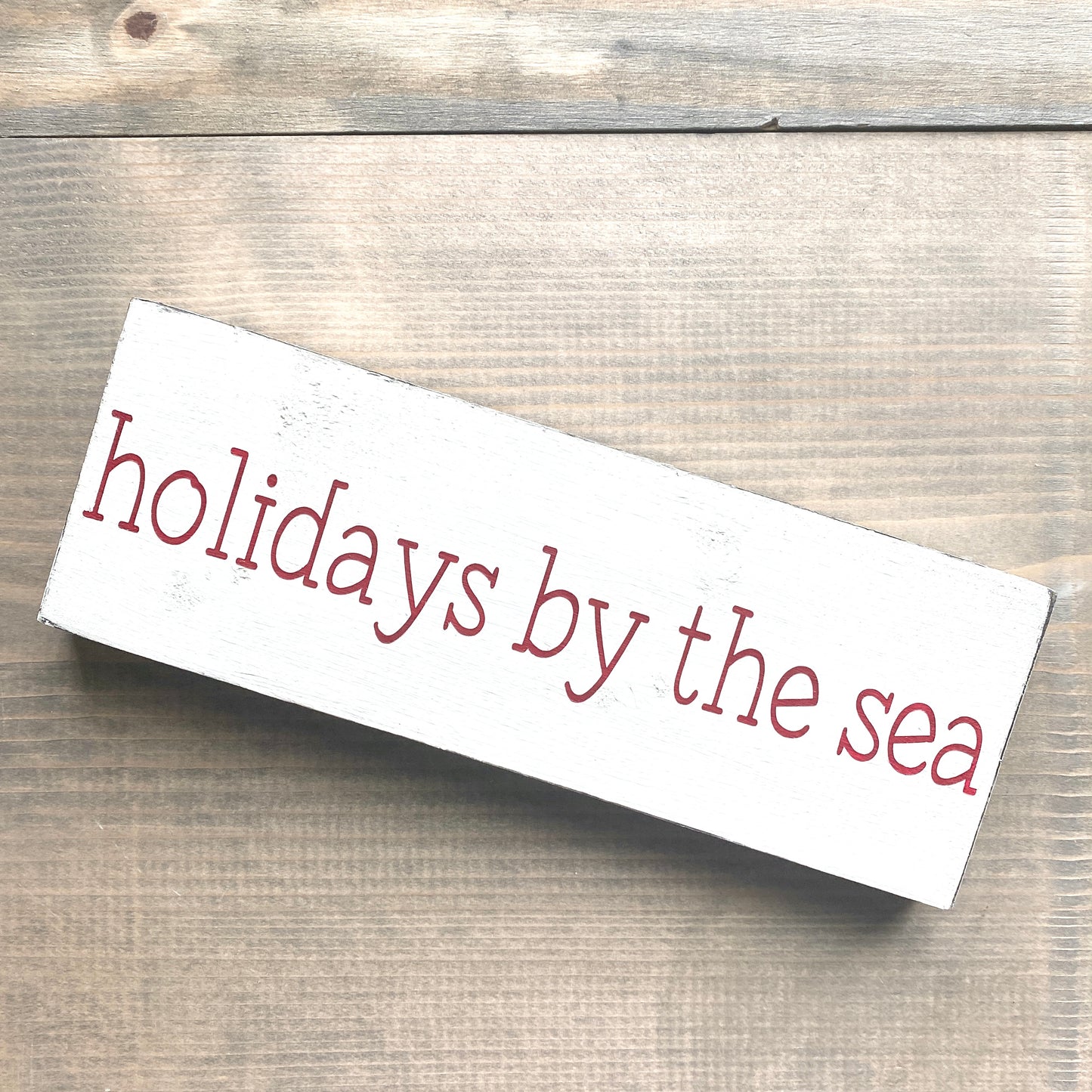 Holidays by the sea sign