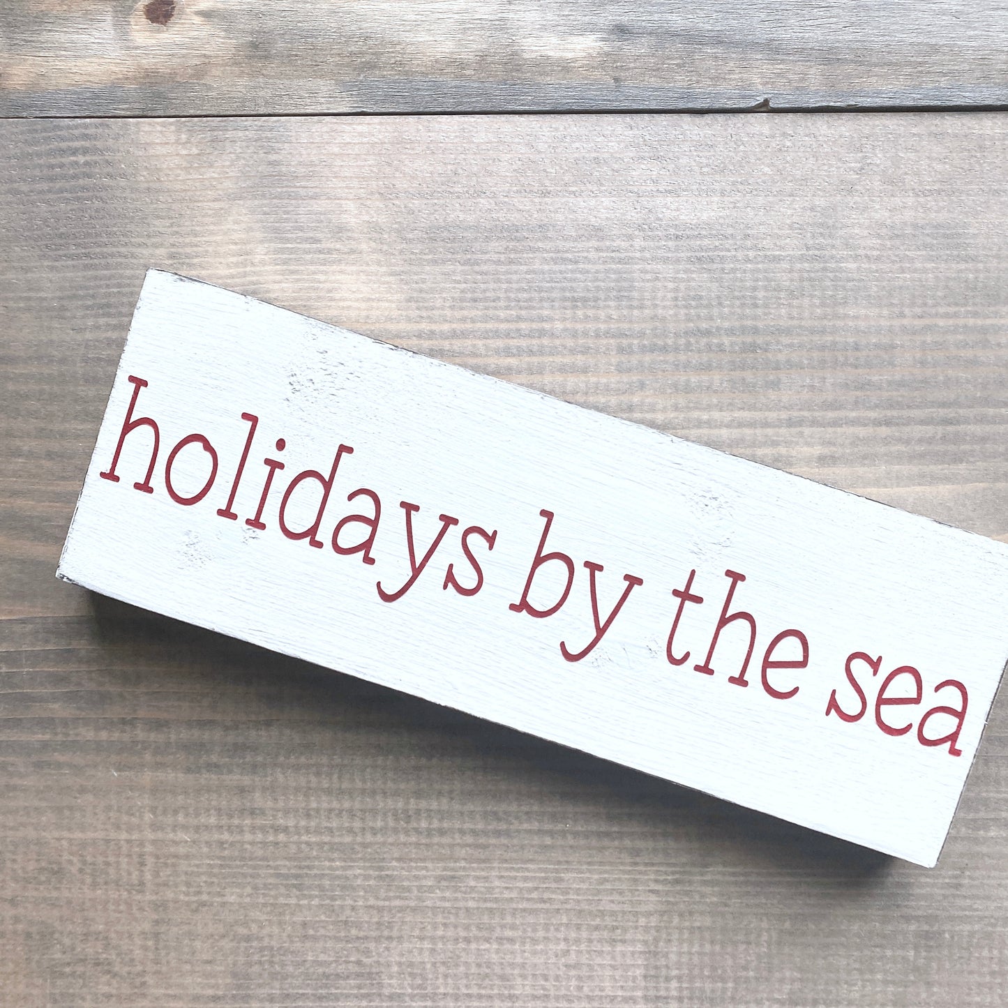 Holidays by the sea sign