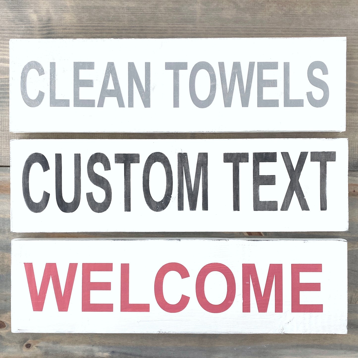 Set of customizable text signs on a wooden background
