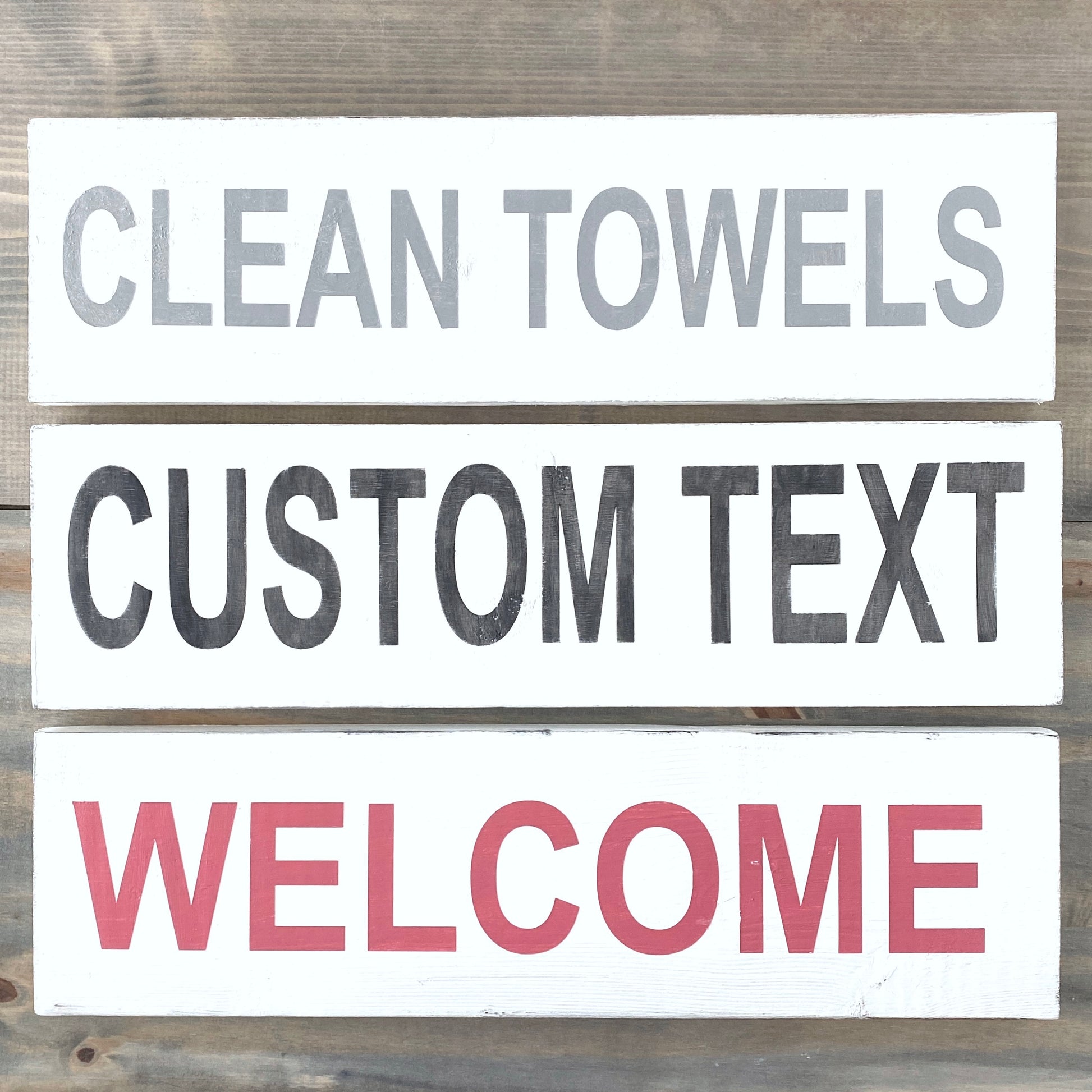 Set of customizable text signs on a wooden background