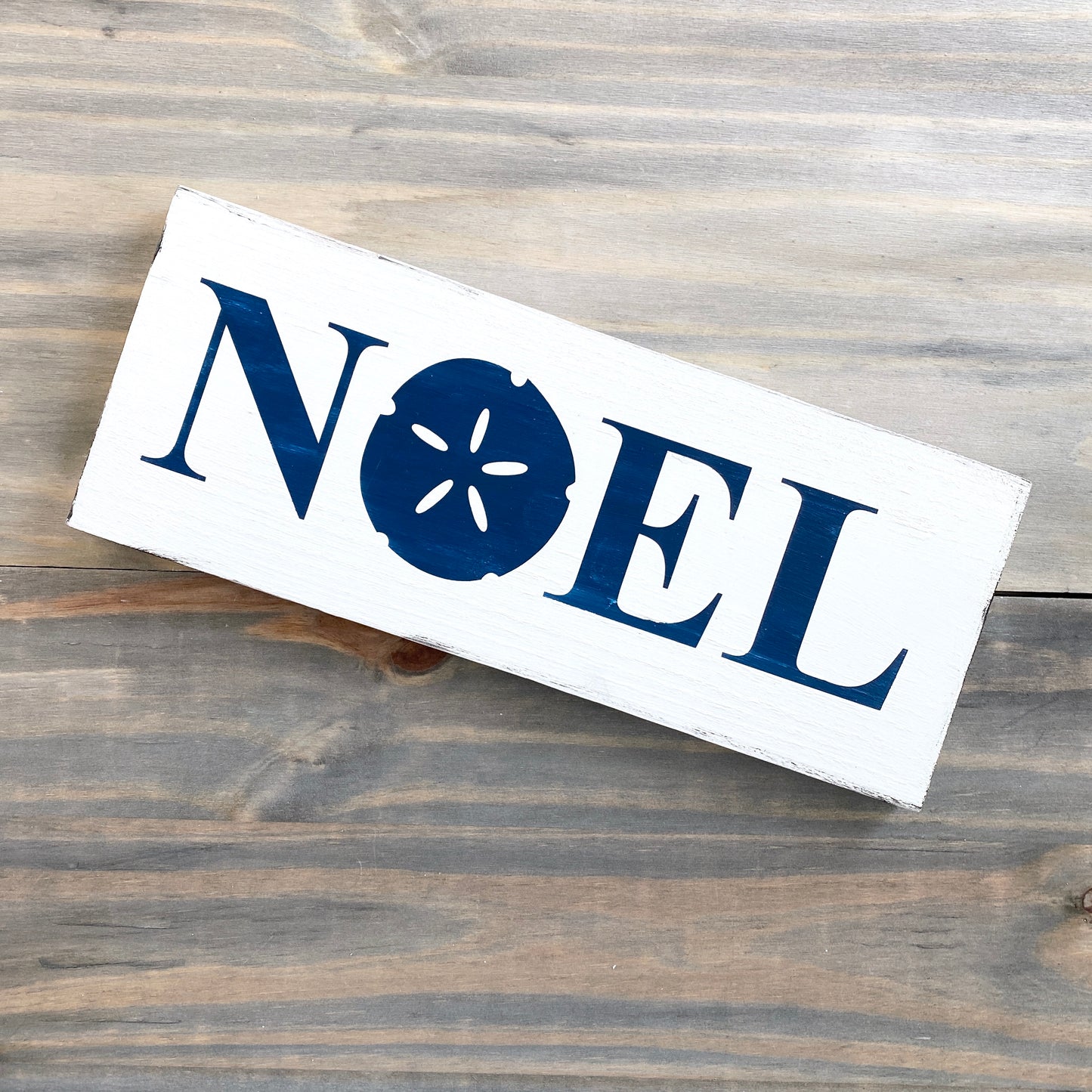 Noel Sand Dollar Sign