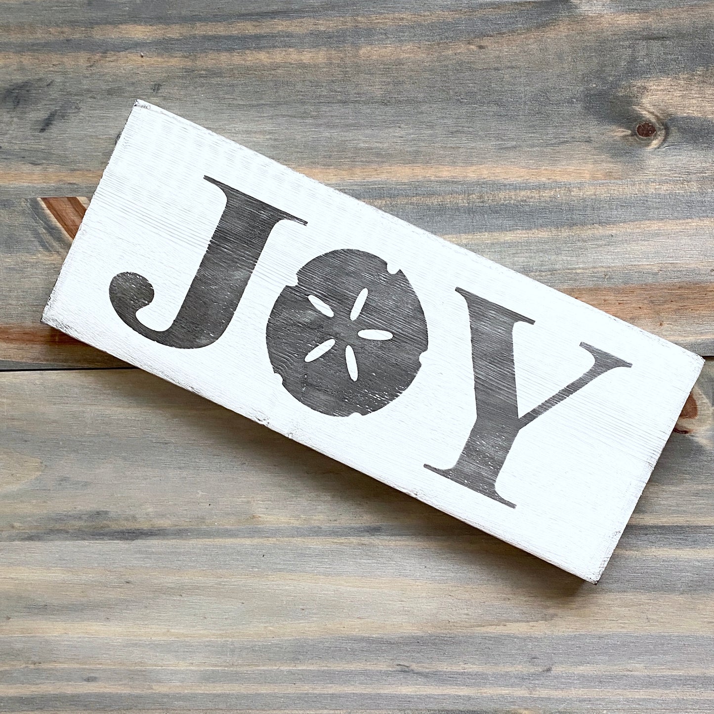 Joy Sand Dollar Sign