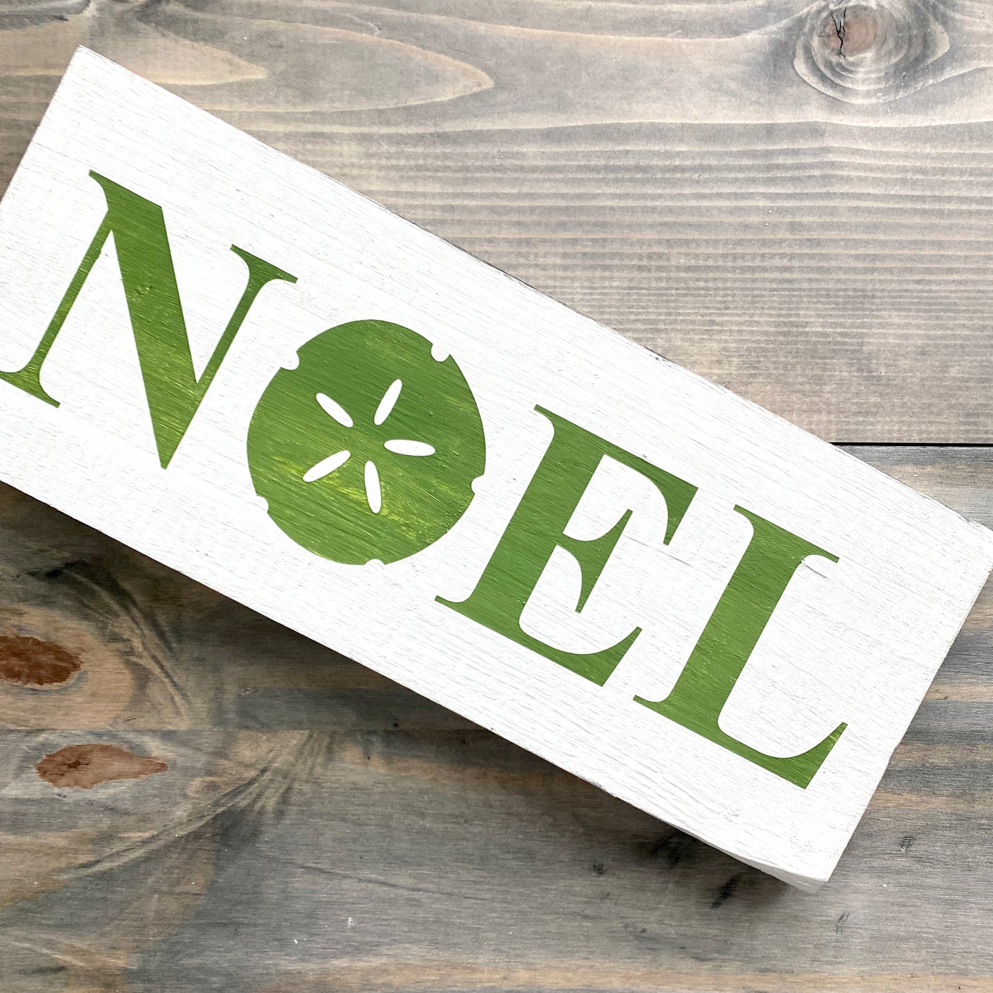 Noel Sand Dollar Sign